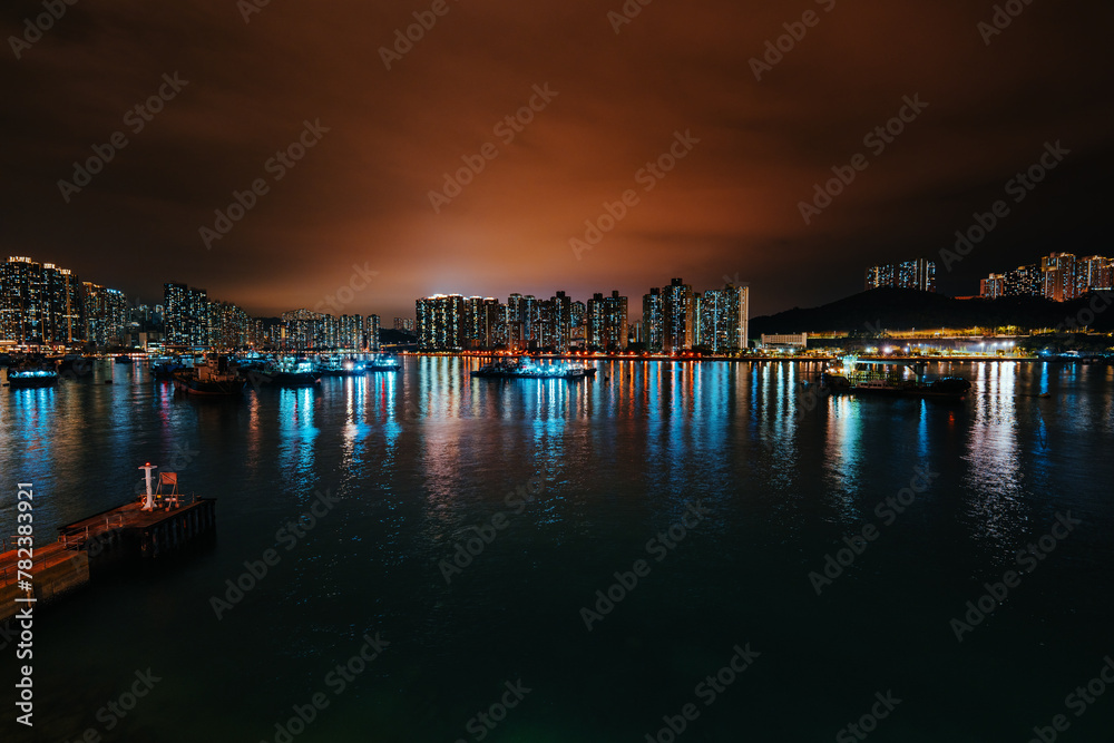 Picturesque views of Hong Kong bay and high buildings at night