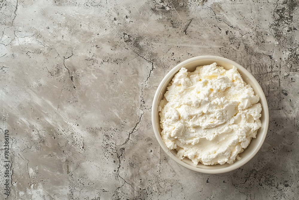 Italian dessert ingredients in white bowl with copy space on concrete background Creamy texture Italian dessert ingredients in white bowl with copy space on concrete background Creamy texture