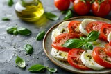 Mozzarella cheese tomatoes olive oil basil leaves on concrete background Healthy vegetarian salad