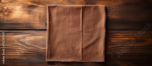 Brown linen napkin on wooden table