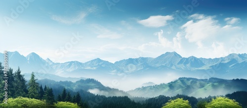 Lush green mountains under clear blue sky photo