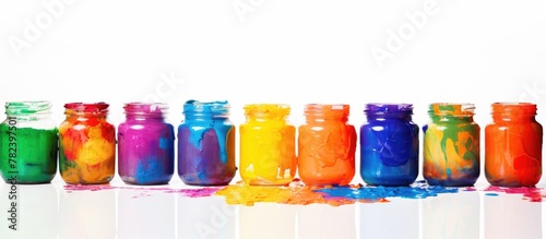 Row of colorful paint jars