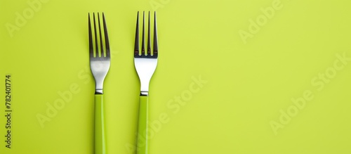 Green Forks on Table with K...