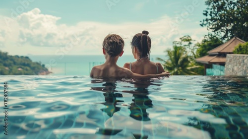 Happy family concept mother and son relaxing together in swimming pool at resort. AI generated