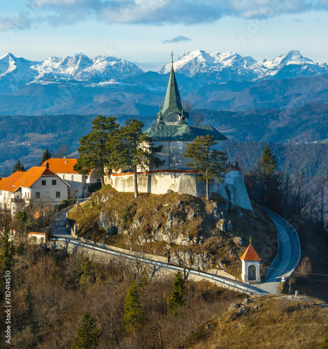 Pilgrimage site Sveta gora in Zasavje with Kamnik-Savinja Alps in the background, Slovenia