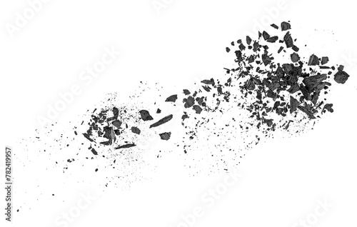 Black charcoal dust isolated on a white background, top view. Natural hardwood charcoal.