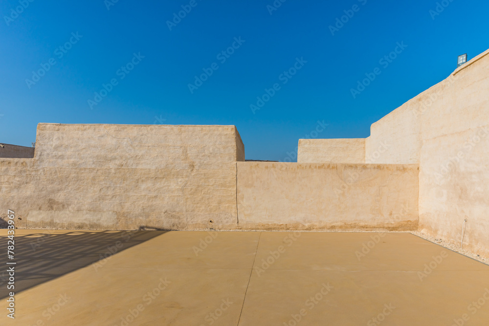 The desert coastal town (ghost town) of Jazeera Al Hamra includes a fort, three schools, an open-air market and mosques nestled between hundreds of villas. Ras Al Khaimah, UAE The desert coastal town (ghost town) of Jazeera Al Hamra includes a fort, three schools, an open-air market and mosques nestled between hundreds of villas. Ras Al Khaimah, UAE