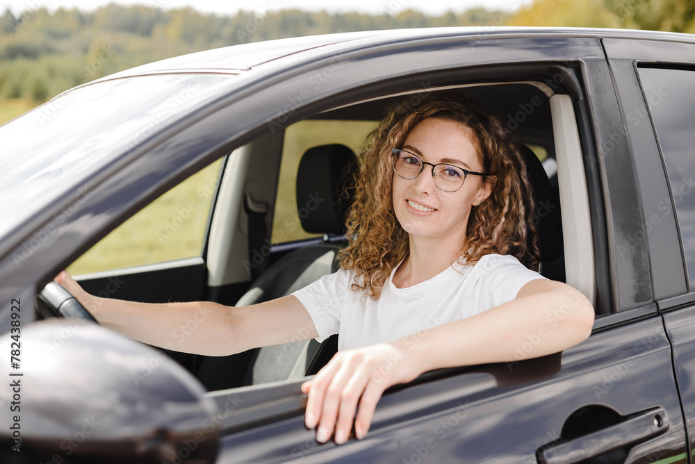 young woman in car