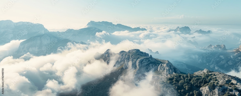 mountain peaks above the clouds. mountain peaks above the clouds.