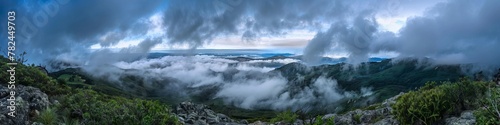 mountain peaks above the clouds. © Yahor Shylau 