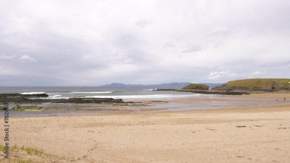 A pan to the right, showing the colours of the beach, sea, rocks and cliffs of the Atlantic Coast. Bundoran, Co. Donegal, Ireland A pan to the right, showing the colours of the beach, sea, rocks and cliffs of the Atlantic Coast. Bundoran, Co. Donegal, Ireland