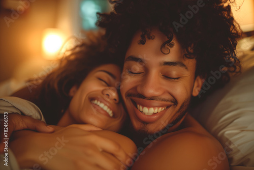 Man and Woman Cuddle Together on Bed