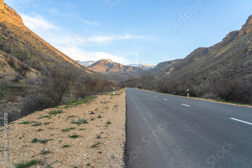 Asphalt road surrounded by mountains, natural luxury picture, travel concept, stock photo