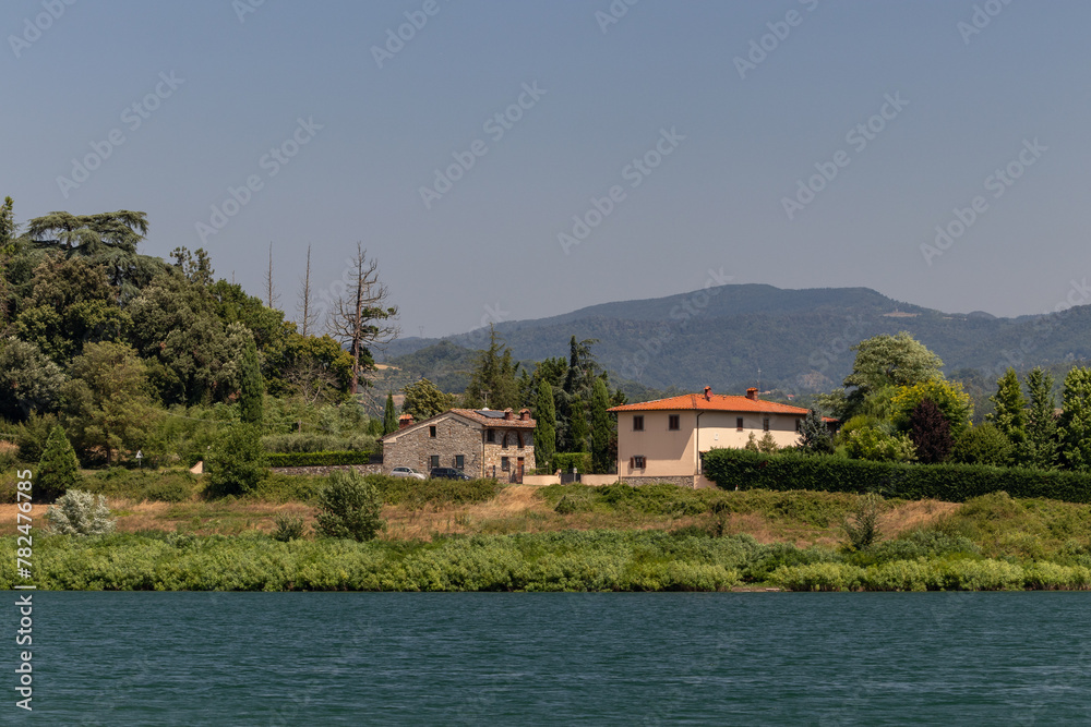 The Bilancino Lake. Lago di Bilancino, Barberino del Mugello, Florence, Italy: landscape at dawn of the picturesque lake in the Tuscan hills