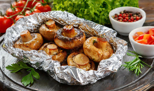 Grilled mushrooms in foil with vegetables. 