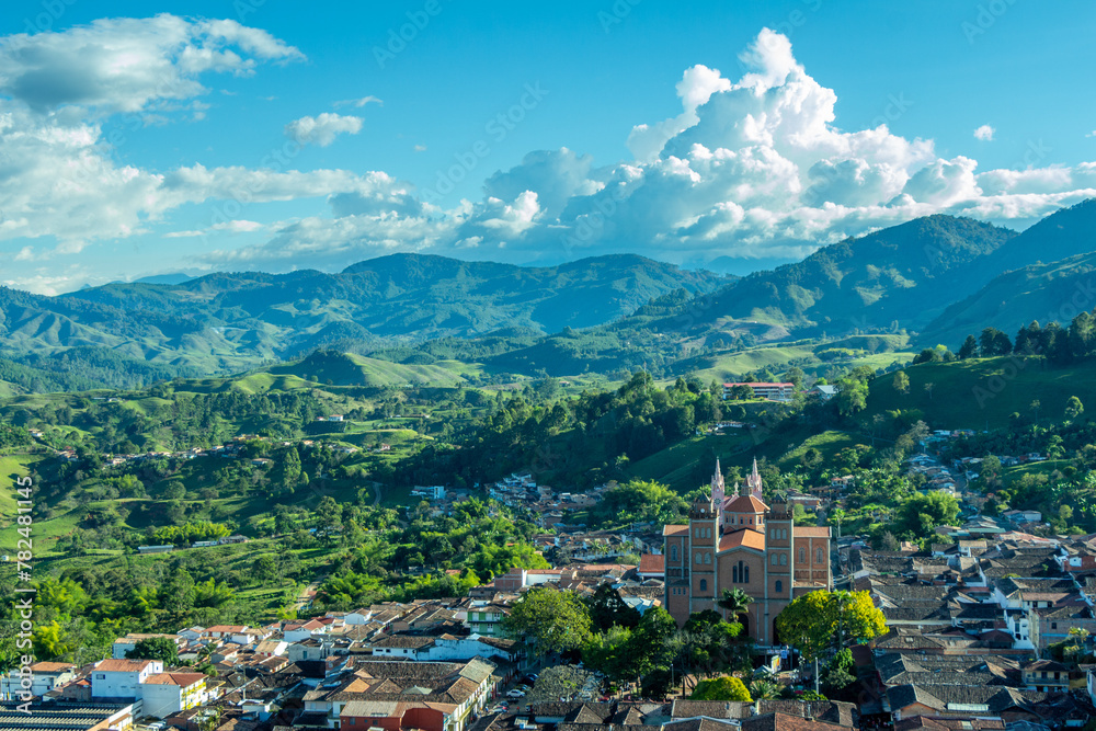 Wide panorama of the superb village (pueblo) of Jerico, Jericó Antioquia, Colombia, with a blue sky and the majestic Andes Mountains in the background. Picture taken from El Morro El Salvador.