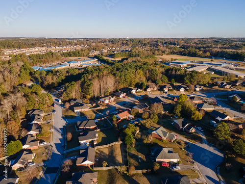Aerial sunset landscape of suburban neighborhood Euchee Creek Trails in Grovetown Augusta Georgia photo