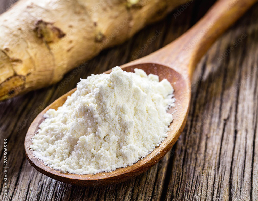 Wooden spoon with manioc flour. Root used in Brazilian cuisine Wooden spoon with manioc flour. Root used in Brazilian cuisine