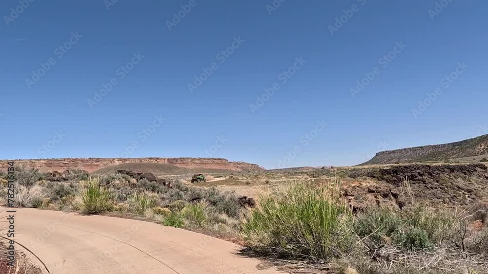 Desert abandoned golf course path southern Utah POV fast motion. Cart path desert of southern Utah. Southwest off road trail riding in 4x4 all terrain vehicle for sport and recreation. Adventure. Desert abandoned golf course path southern Utah POV fast motion. Cart path desert of southern Utah. Southwest off road trail riding in 4x4 all terrain vehicle for sport and recreation. Adventure.
