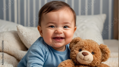 cute little baby with teddy bear at home