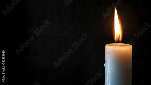 White candle lit on a black background giving light in high resolution and high quality. lighting concept, fire, candle, light, darkness, night