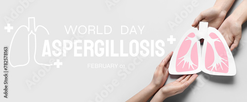 Hands with paper lungs on light background. Banner for World Aspergillosis Day photo