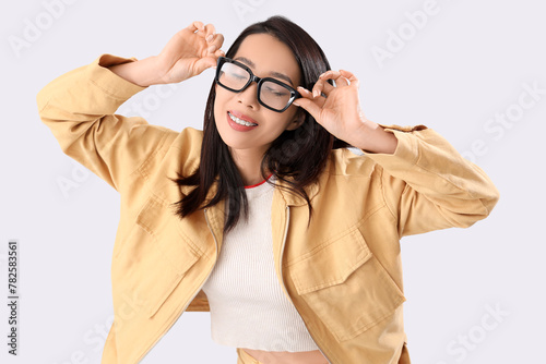 Young Asian woman in eyegla...