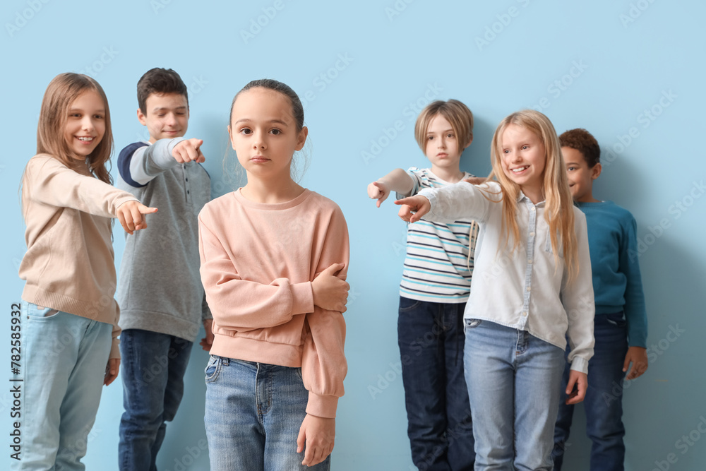 Bullied little girl and pupils on blue background - obrazy, fototapety, plakaty 