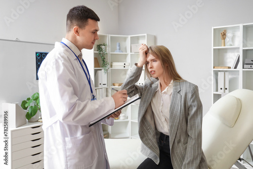 Young businesswoman with brain concussion visiting doctor in clinic