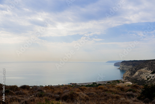 Landscape with huge rocks and view on small village near the sea in Cyprus