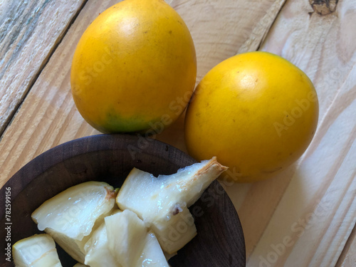 Abiu fruit cut in wooden bowl and served in dessert
 photo