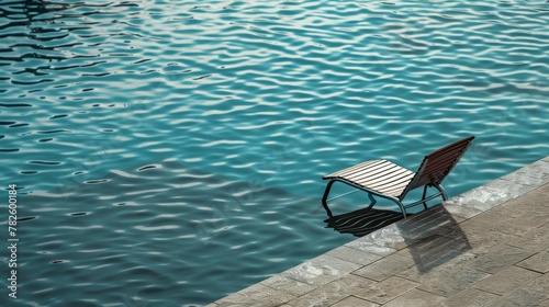 A lone lounge chair by the edge of the pool  AI generated illustration © ArtStage