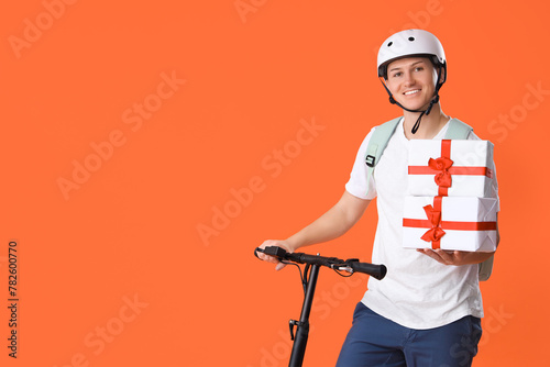Male courier with gift boxe...
