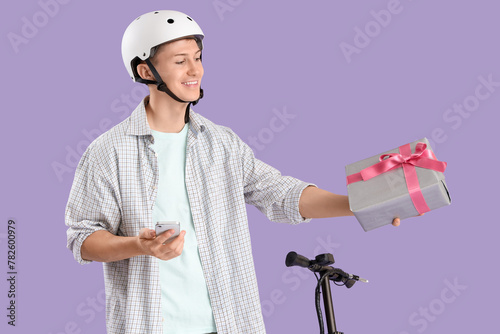 Male courier with gift box,...