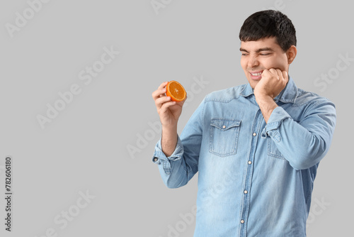 Young man with orange suffe...