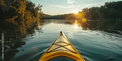 Sunset kayaking on calm river with forested landscape, warm colors, tranquil outdoor activity, yellow kayak, nature backdrop. Copy space. © BrightWhite