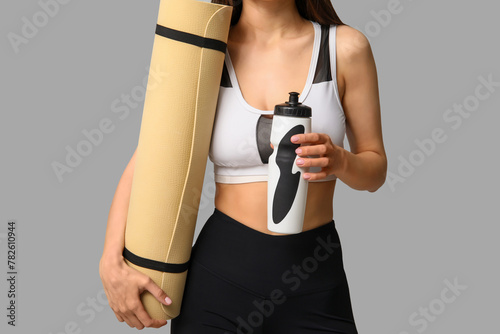 Woman in sportswear holding...