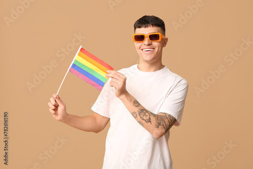 Smiling young man in orange...