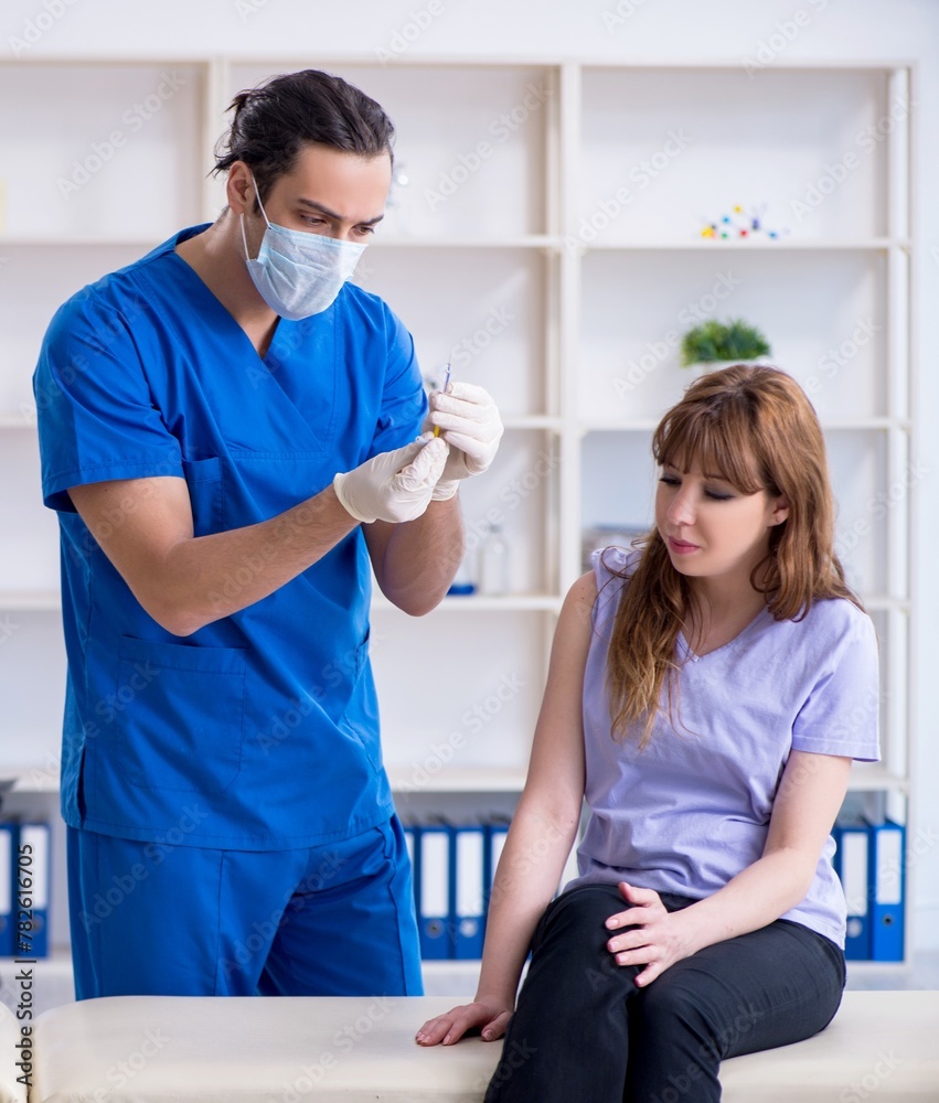 Two doctors examining young woman Two doctors examining young woman