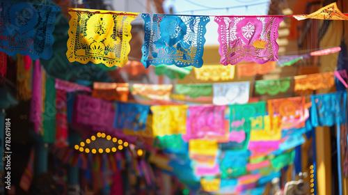 Colorful cutout papel picado hang in market  celebrating Cinco de Mayo