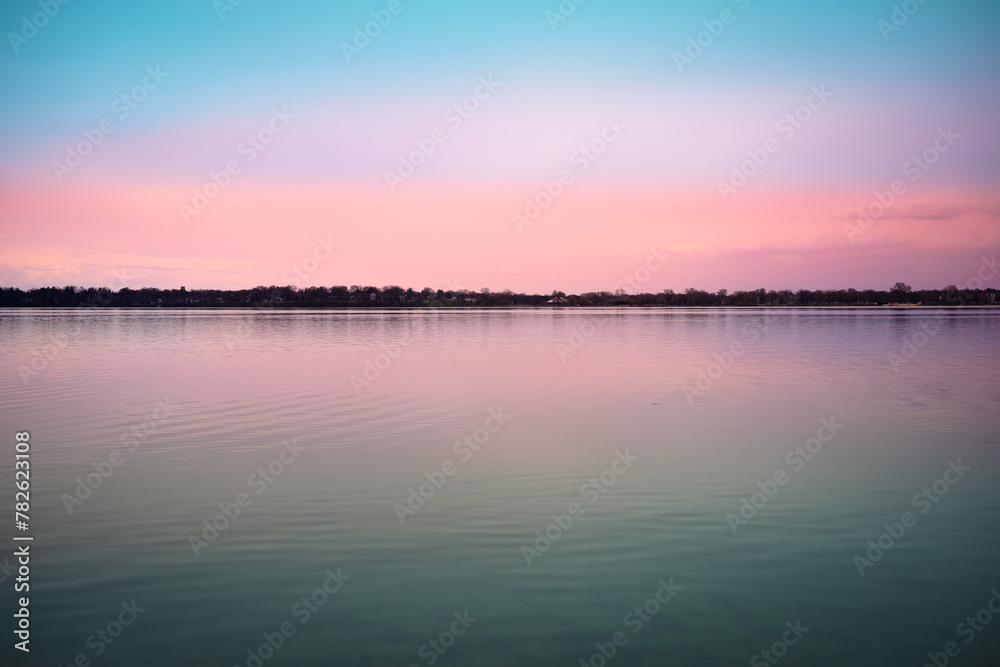 Tranquil relaxing sunset landscape at Schluter Beach in Monona Lake, Dane County, Wisconsin, United States, a suburb of the state capital Madison