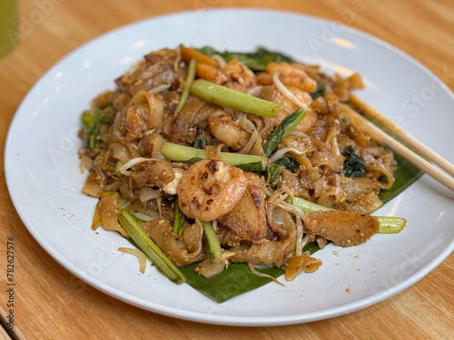 fried rice noodle in plate, kwetiau goreng
