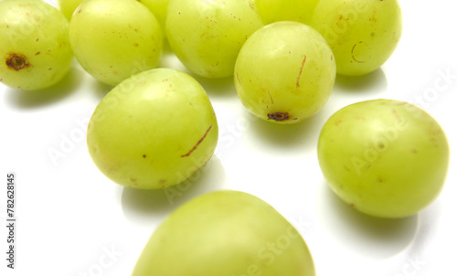 green grapes on white background. green grapes isolated on white. group of green grapes. © Mauri