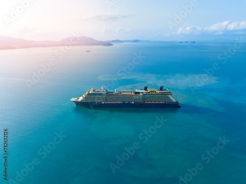 Aerial view of beautiful white cruise ship above luxury cruise. Cruise ship sailing across The Mediterranean sea - Aerial footage. 