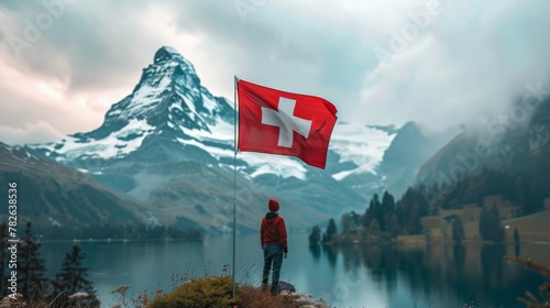 he Swiss flag fluttering in the wind.  photo