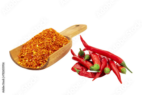 Cayenne pepper in a wooden spoon and fresh red chilies, spicy condiments Isolated on a white background - clipping path. © WIROT