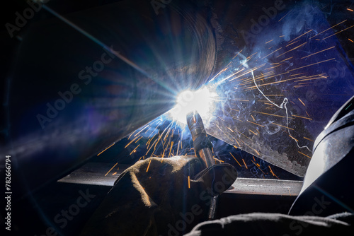 Fotografie Welding two metal structurer parts with flux core arc welding