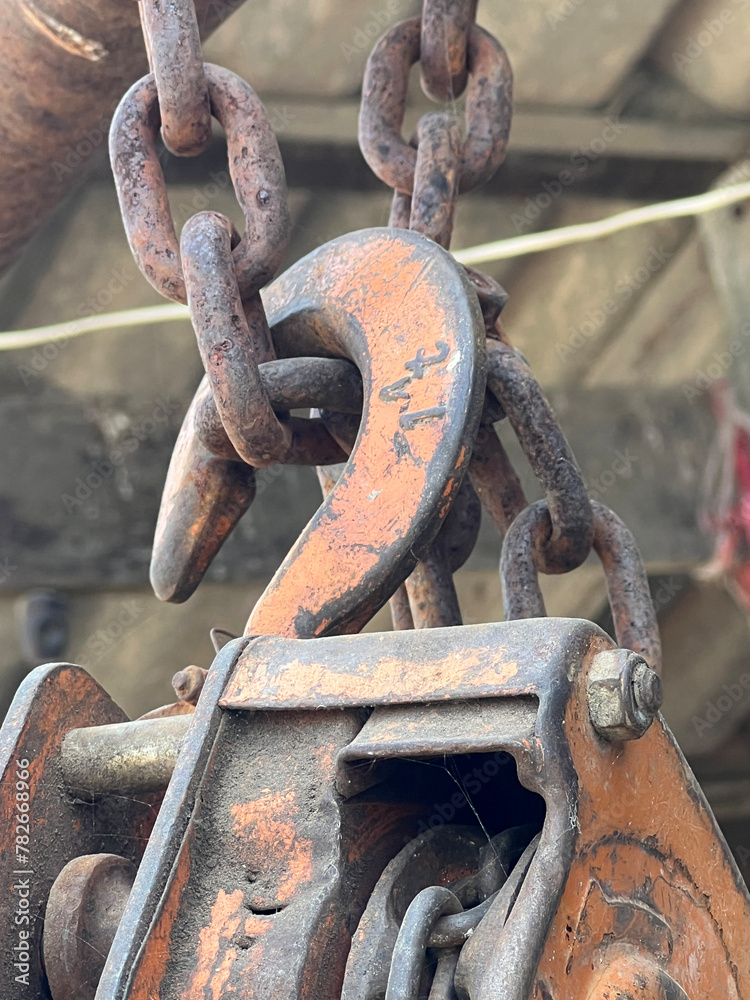 rusty chain and reel on the street rusty chain and reel on the street
