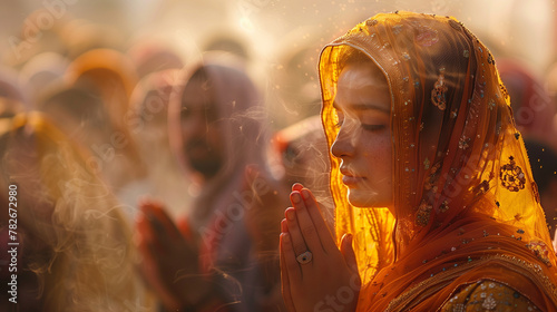 A serene young woman in an ornate saree prays amidst a crowd, embodying spiritual devotion during a cultural festival.