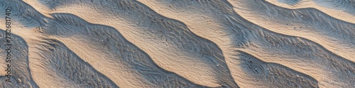 Tranquil twilight enhances natural patterns over undulating desert sand. Banner.